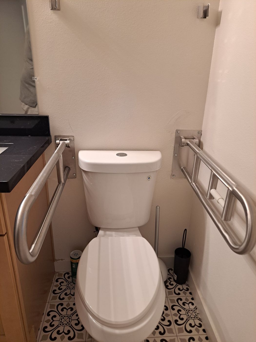 Toilet area with grab bars on both sides for safety at Fountain of Blessings